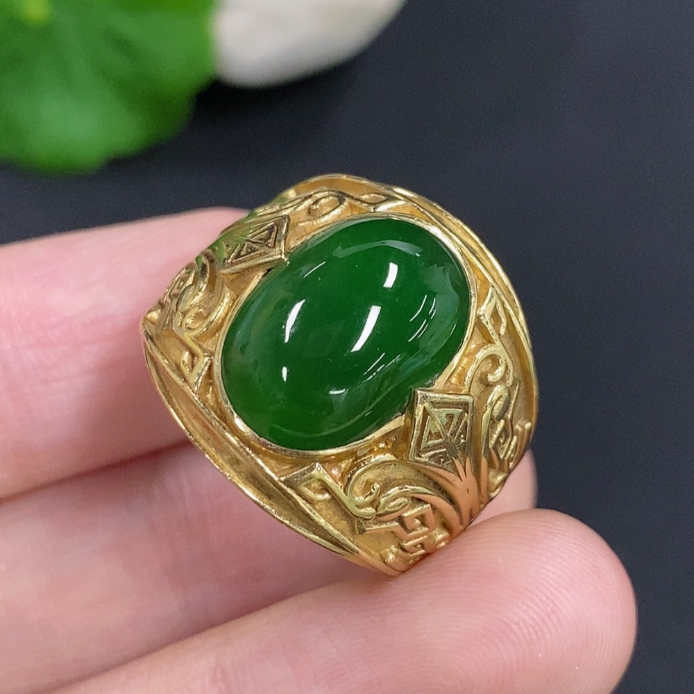 Elegant jadeite cabochon ring set in 18K gold from HKHQ, showcasing a smooth, polished green gemstone on a sleek gold band.
