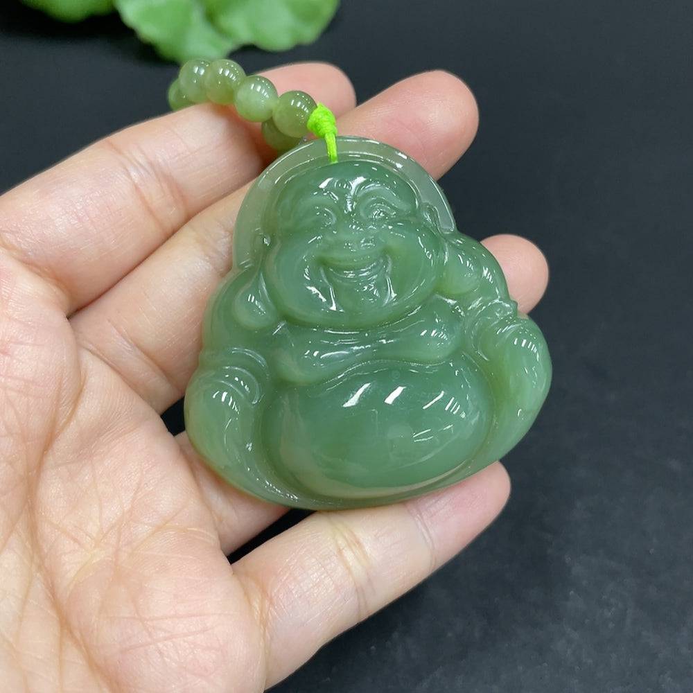 Huiliu certified Hetian jade pendant with Buddha design on chain, showcasing smooth green jade craftsmanship.