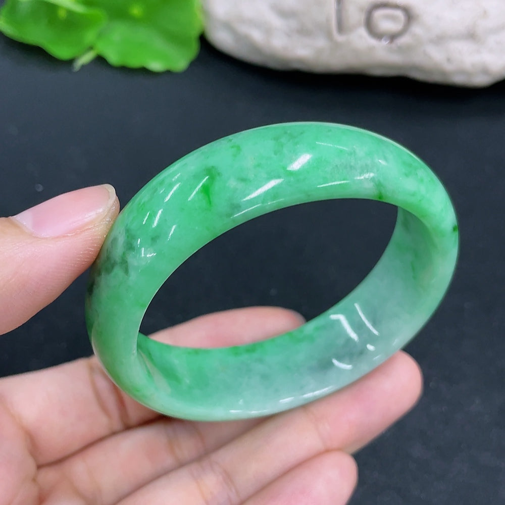 HKHQ jadeite concubine bracelet with 54.1/48.8 size, weighing approx. 49.57g, featuring smooth, polished jadeite beads.