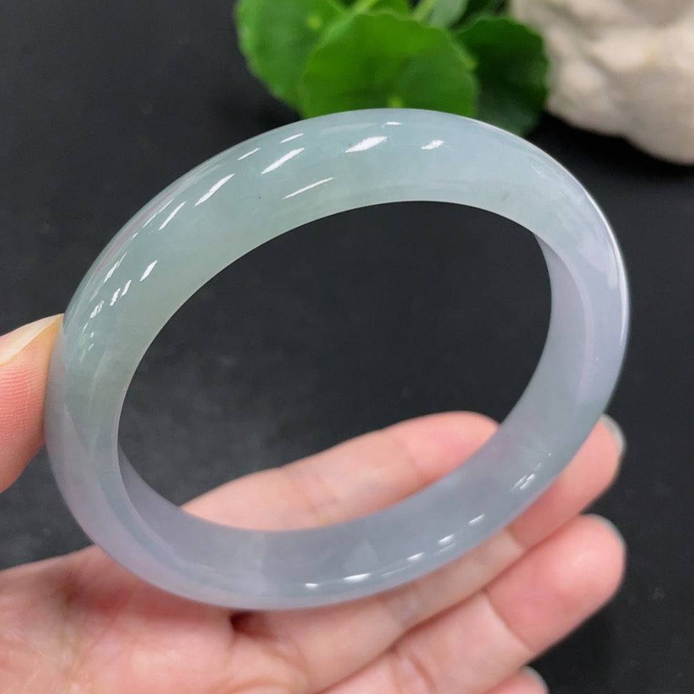 Jadeite round bracelet with size 60, crafted from jade, weighing approximately 54.2g, featuring smooth, polished green jade beads.