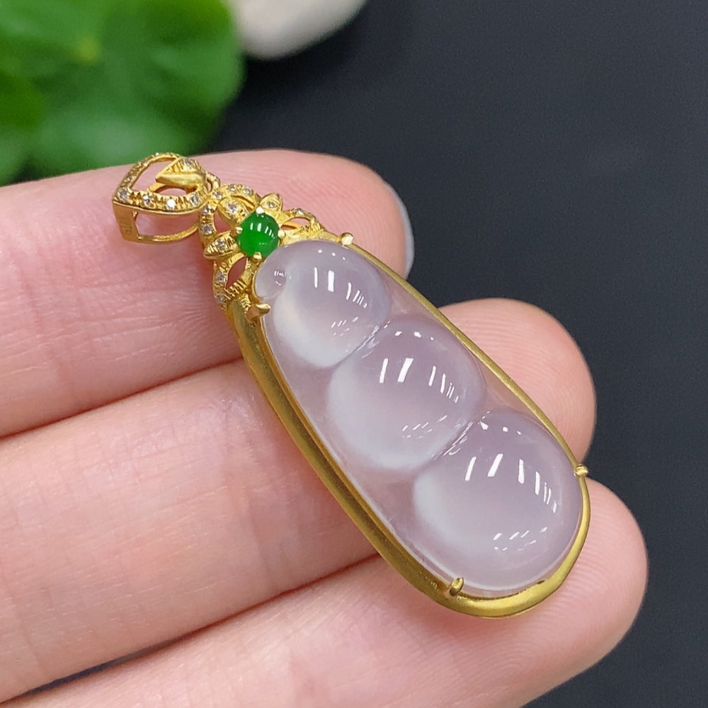Jadeite bean inlay pendant with 18k gold and diamond accents, featuring a smooth jade gemstone and intricate design.