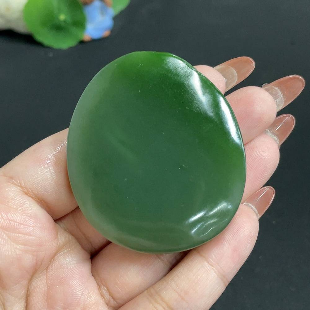 Huiliu Hetian Jade Jasper pendant featuring a lotus and fish design symbolizing abundance, crafted with intricate details.