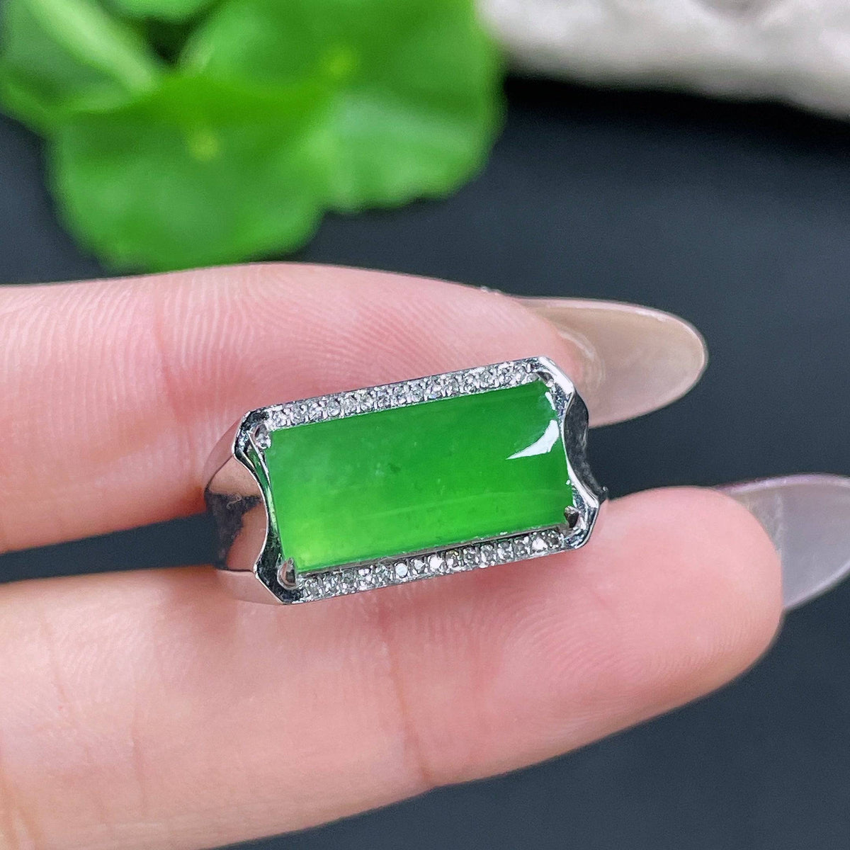HUILIU HQ jadeite ring setting with a diamond, showcasing intricate craftsmanship and a polished jade band.