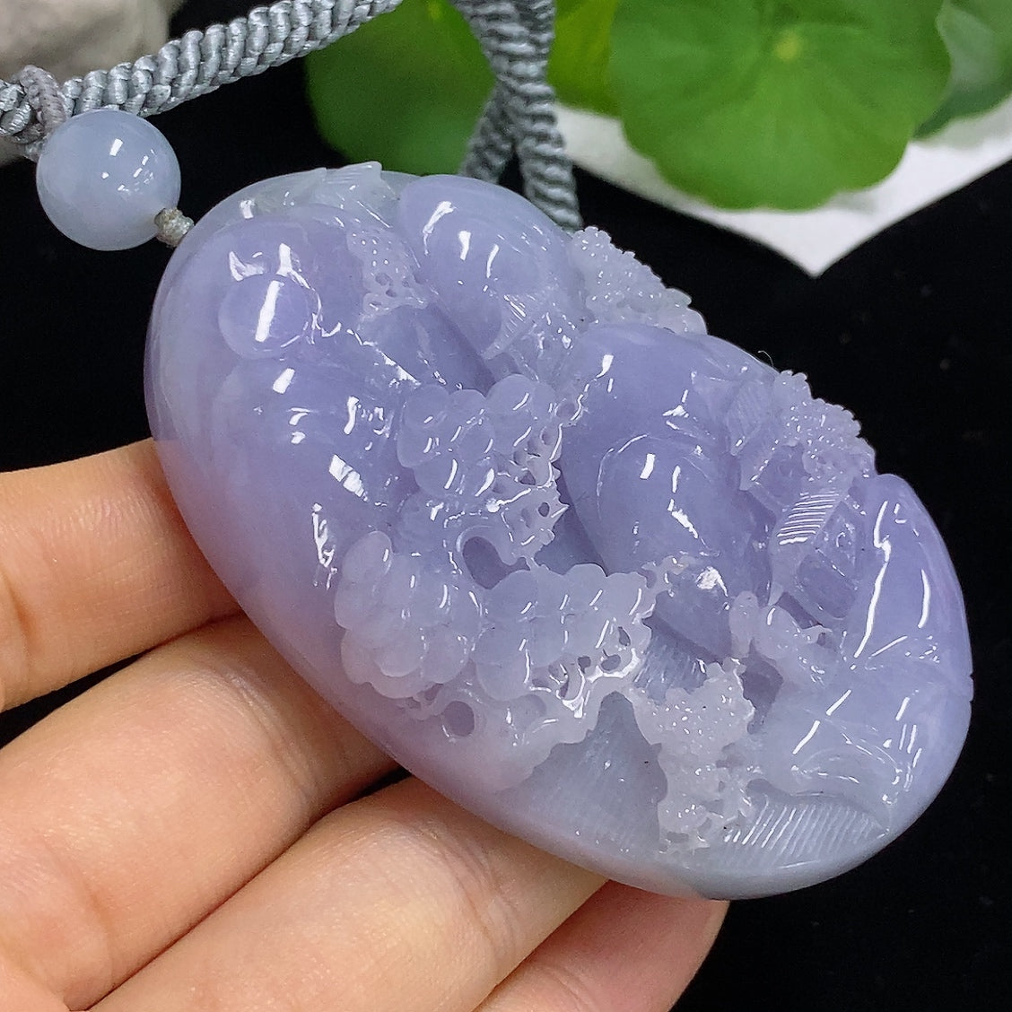 Jadeite pendant featuring a landscape design with a rope, weighing approximately 110.3g, crafted by HKHQ.