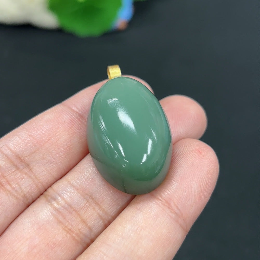 Hetian jade pendant with 18k gold inlay, weighing approximately 12.7g, showcasing intricate jade craftsmanship and elegant design.