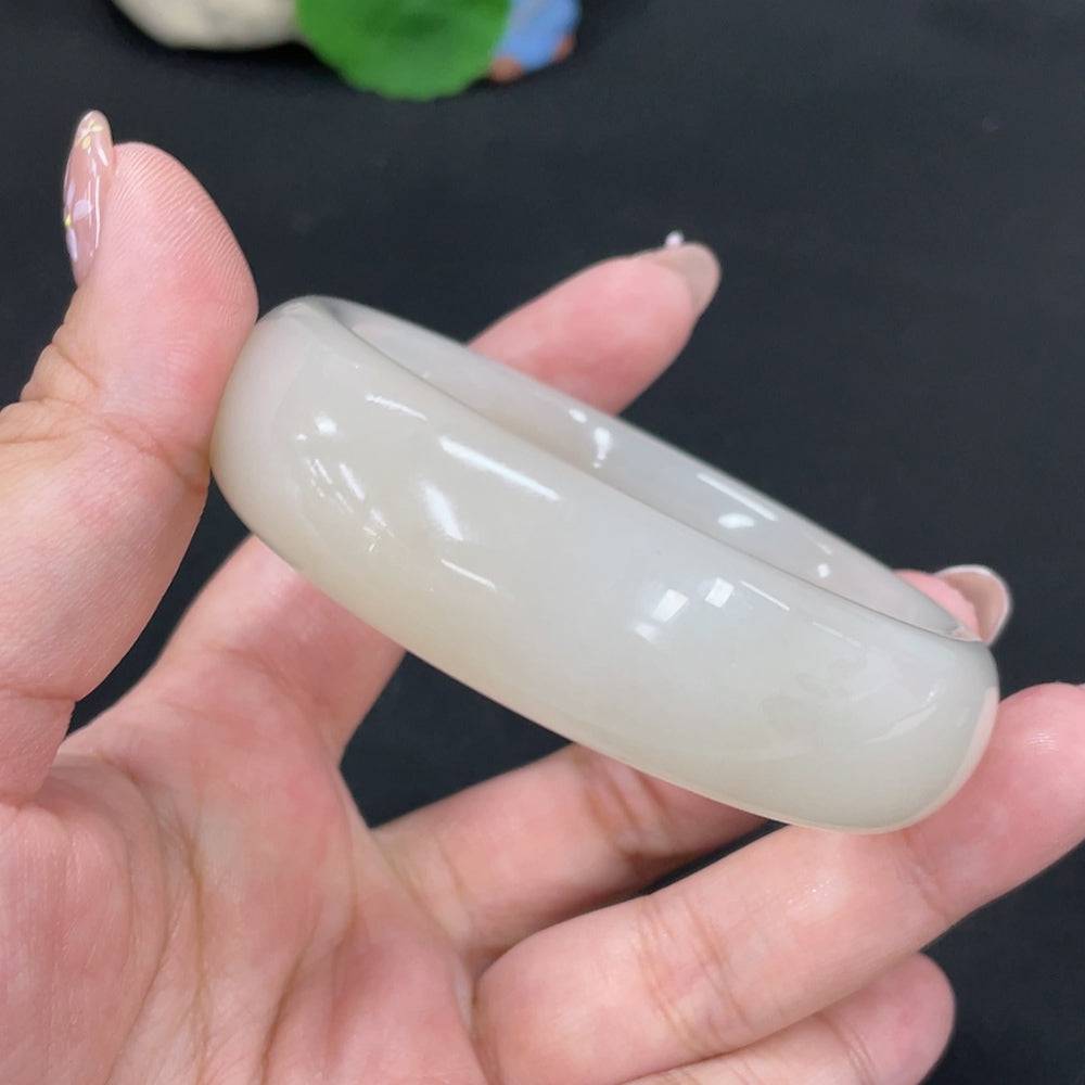 Huiliu certified Hetian Jade round bracelet featuring smooth, polished jade beads in a natural, elegant design.