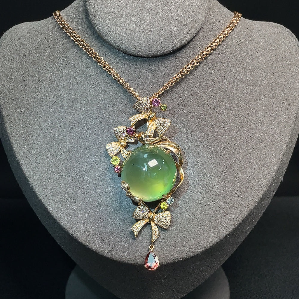 Huiliu Prehnite pendant with colorless diamond accents and tourmaline, featuring a gemstone pendant on a chain.