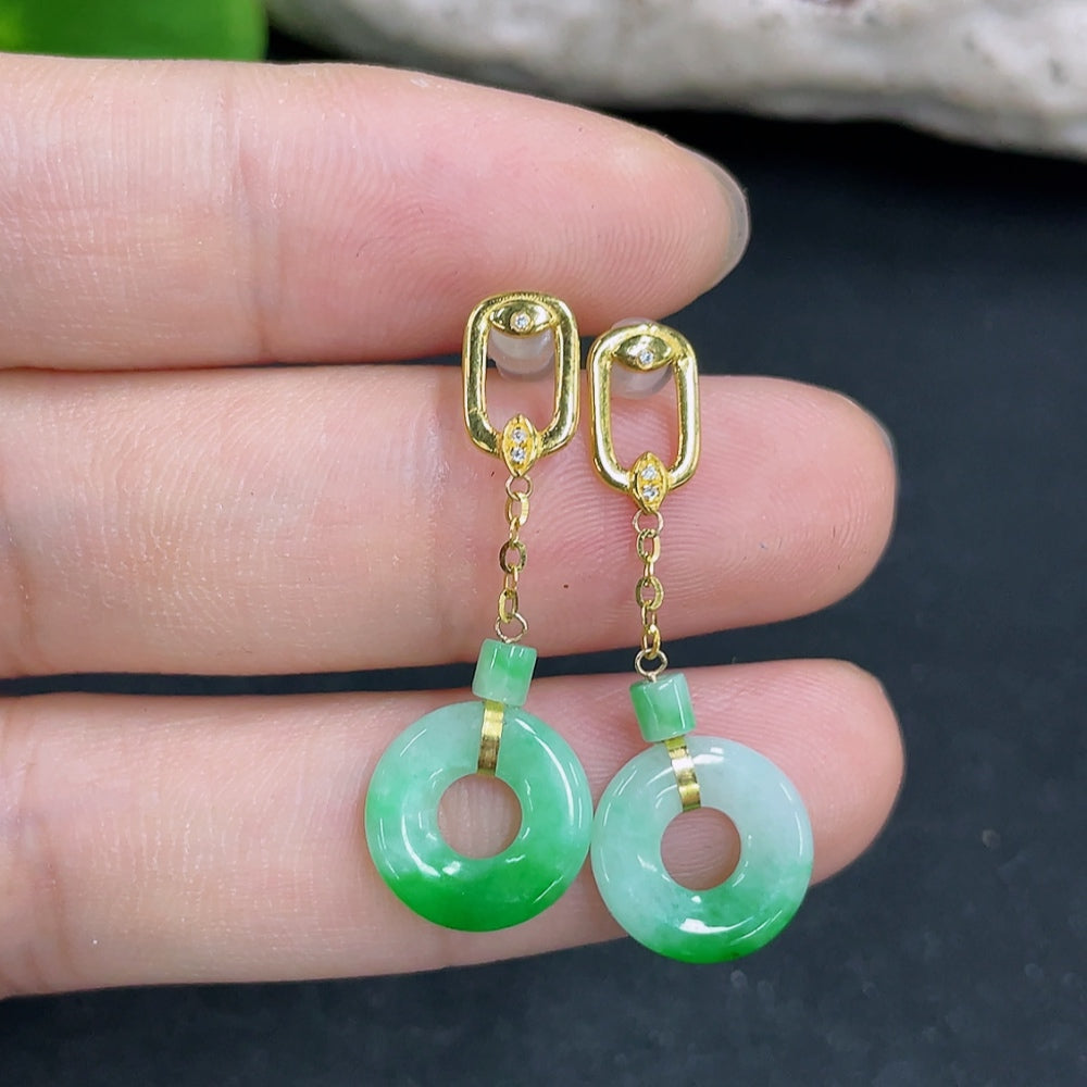 Jadeite earrings by HKHQ featuring smooth green jade stones in a classic drop design, 18k gold setting, lightweight and elegant.