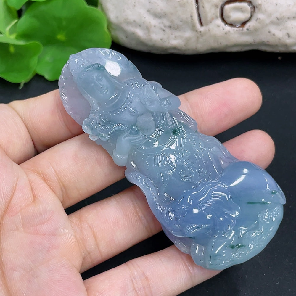 Jadeite pendant featuring Samantabhadra design in a necklace, showcasing a polished green jadeite stone with intricate carving.