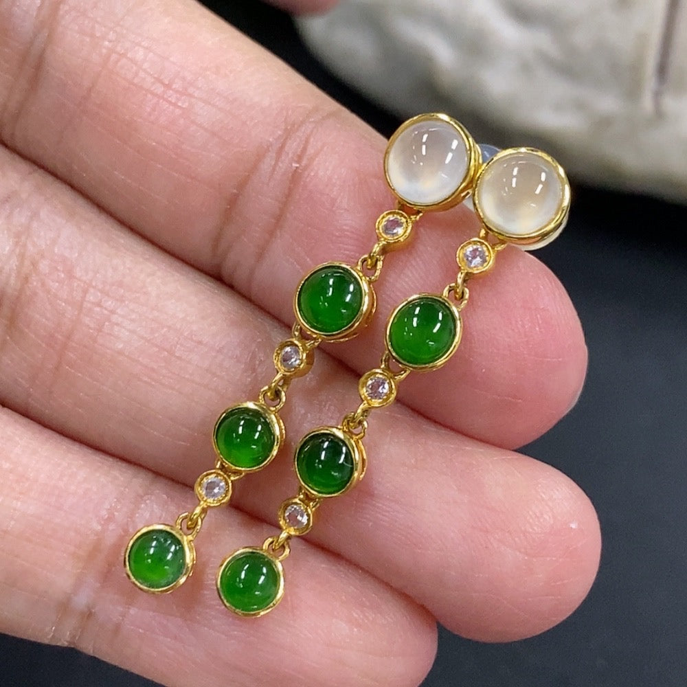 Jadeite cabochon earrings in 18K gold by HKHQ, featuring smooth, polished jadeite stones set in elegant gold settings.