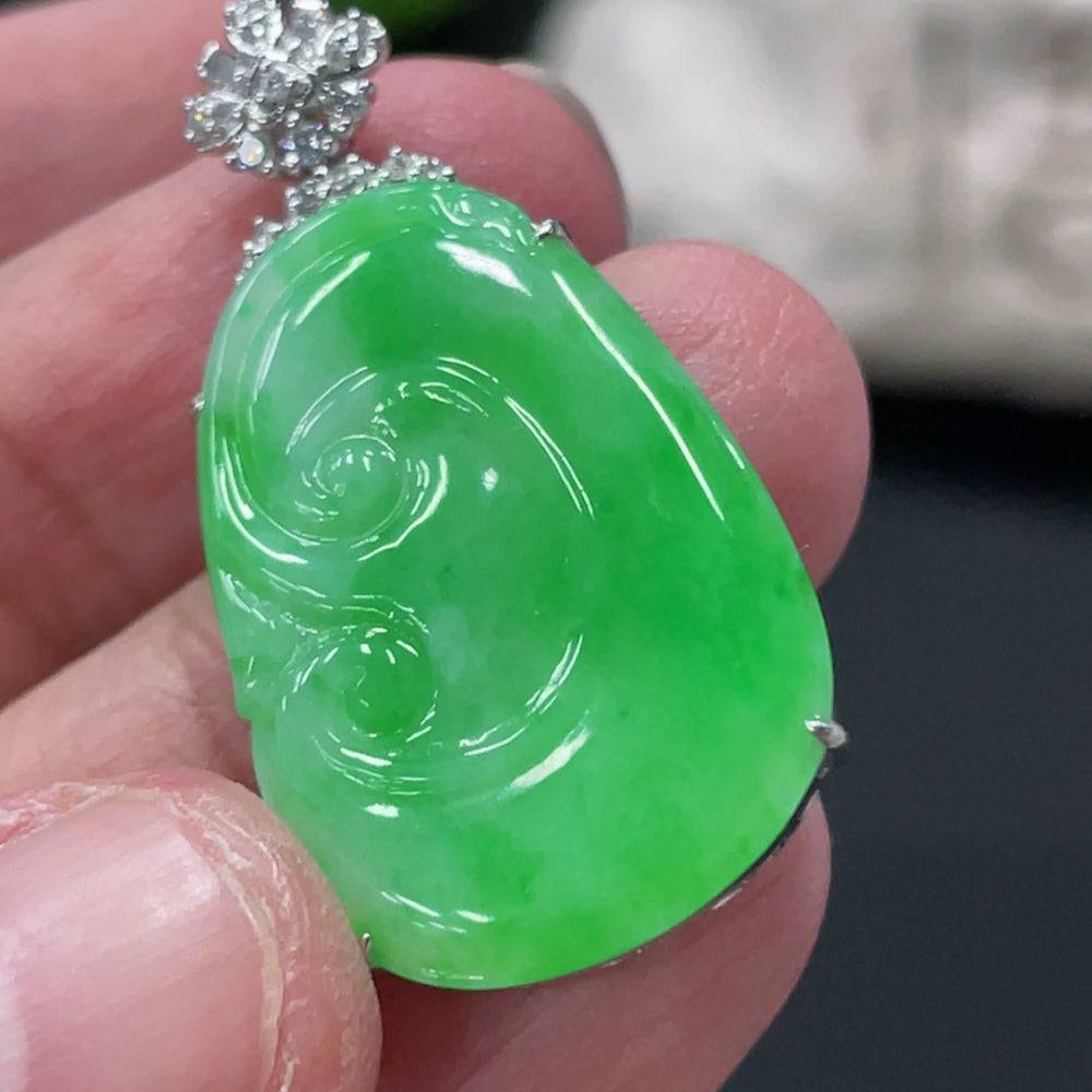 Jadeite Ruyi pendant with 18K gold and diamond accents, showcasing intricate design and polished jade surface, weighs about 5.2g.