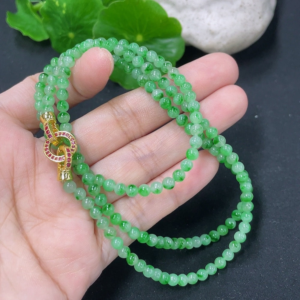 Jadeite bead necklace from HKHQ featuring natural mineral components, non-gold, with smooth, polished jadeite beads.