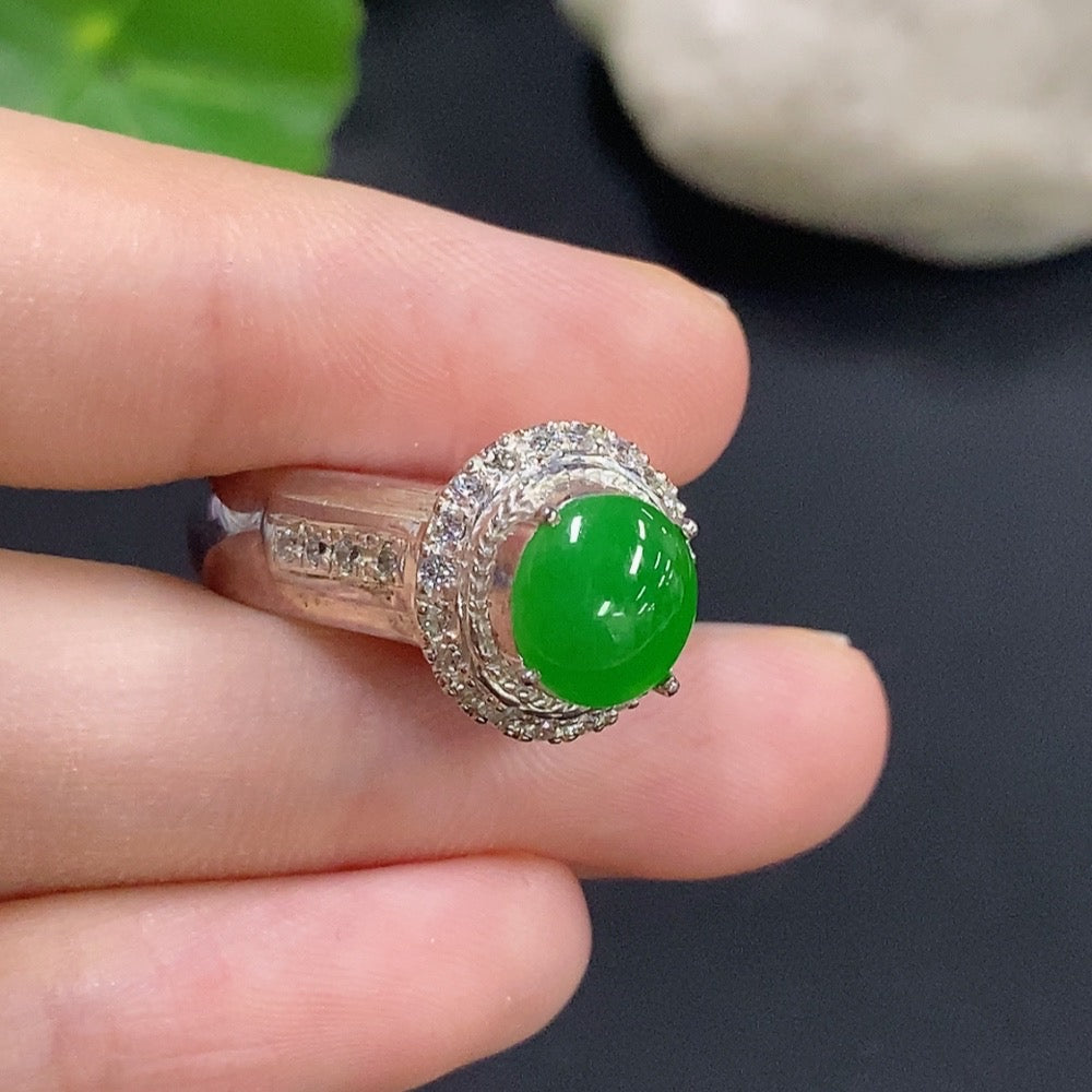 Jadeite cabochon jewelry with a non-gold setting, featuring smooth, polished green gemstone in a stylish jewelry design.