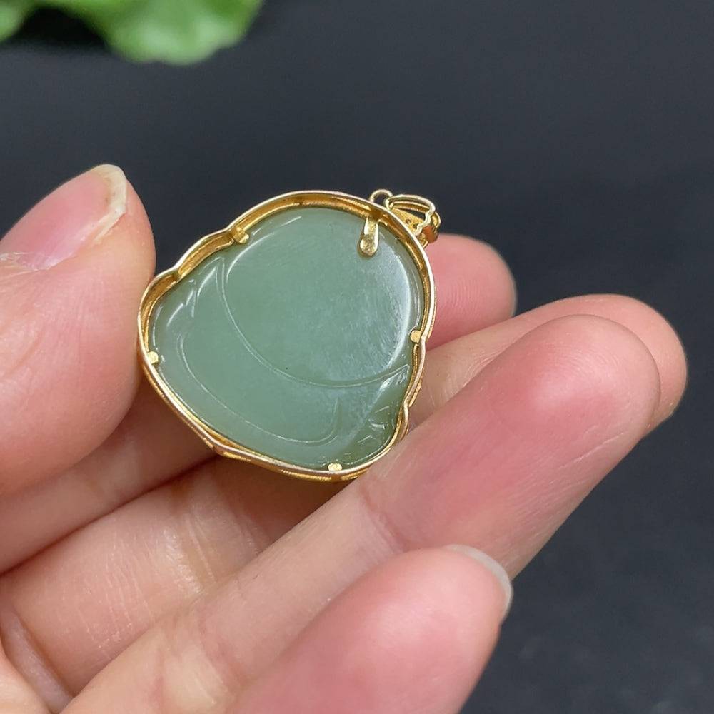 Huiliu Hetian Jade Jasper Buddha pendant with inlaid design, showcasing intricate craftsmanship and smooth, polished surface.