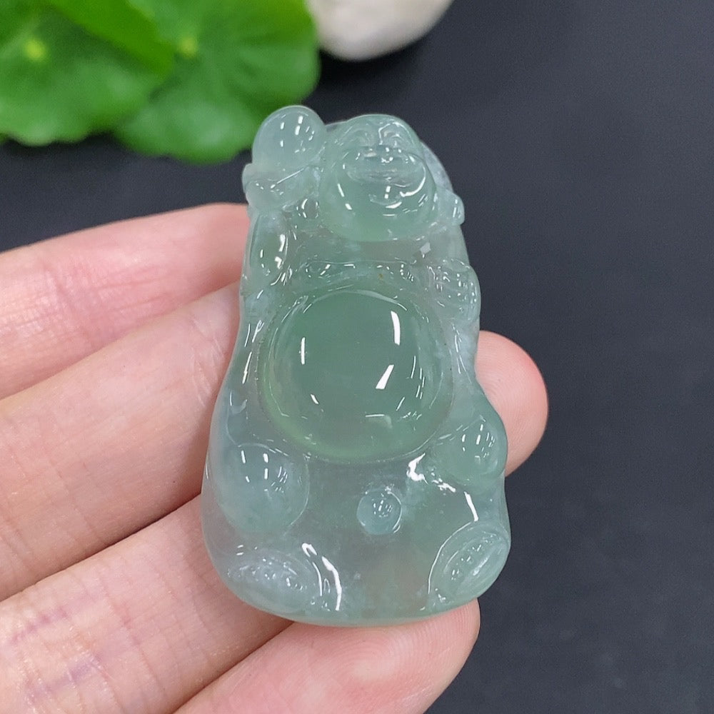 Jadeite Maitreya pendant with detailed carved design, weighing approximately 16.2g, crafted by HKHQ.