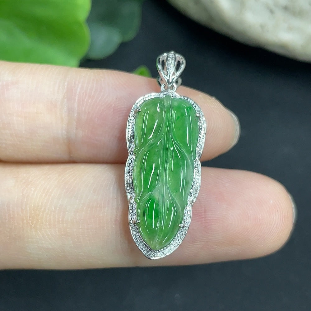 Jadeite leaf pendant necklace in 18K gold with diamond accents, elegant jewelry piece featuring detailed leaf design.