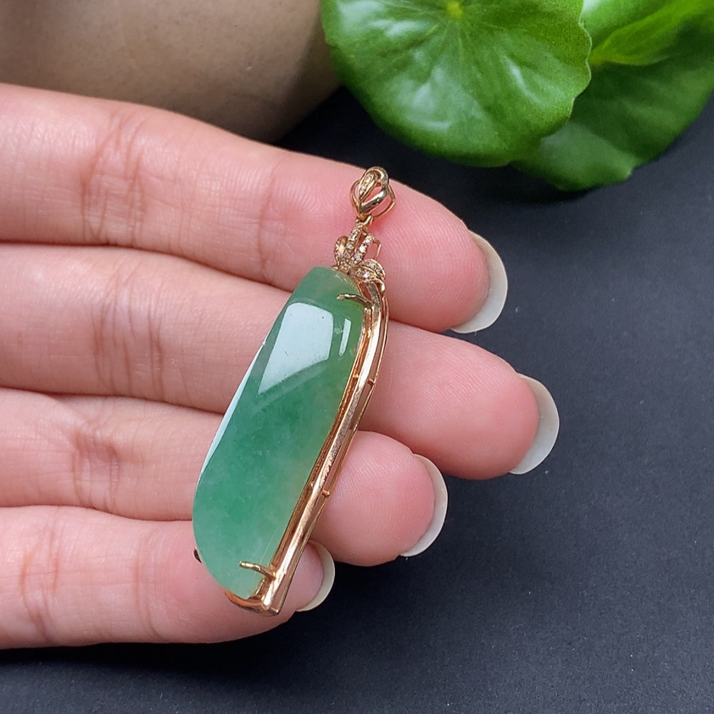 Jadeite inlaid pendant with diamond accents on an 18K necklace, showcasing intricate craftsmanship and elegant design.
