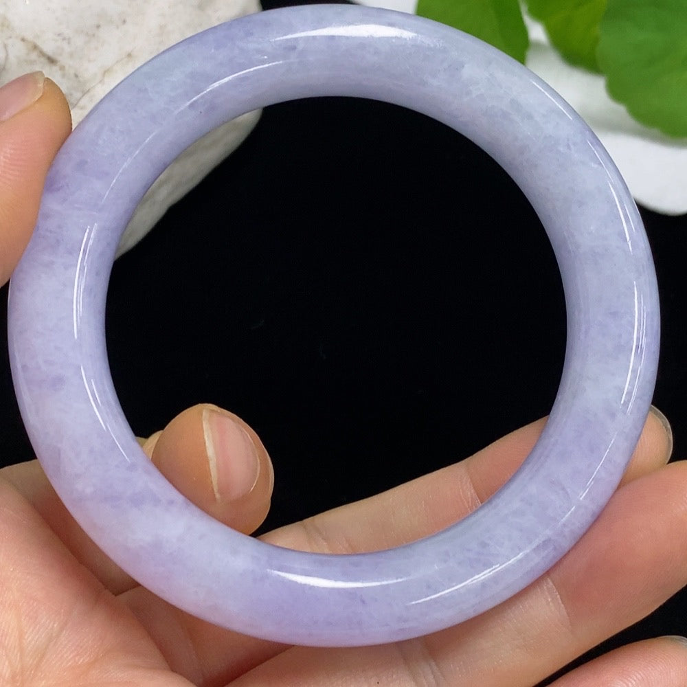 Round jadeite bangle with a size of 55.1 and weight of 65.54g from HKHQ, showcasing smooth, polished jade surface.