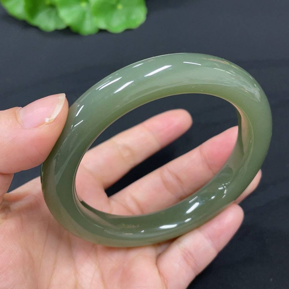 Huiliu certified Hetian jade round bracelet with smooth, polished jade beads showcasing natural green hues and fine craftsmanship.