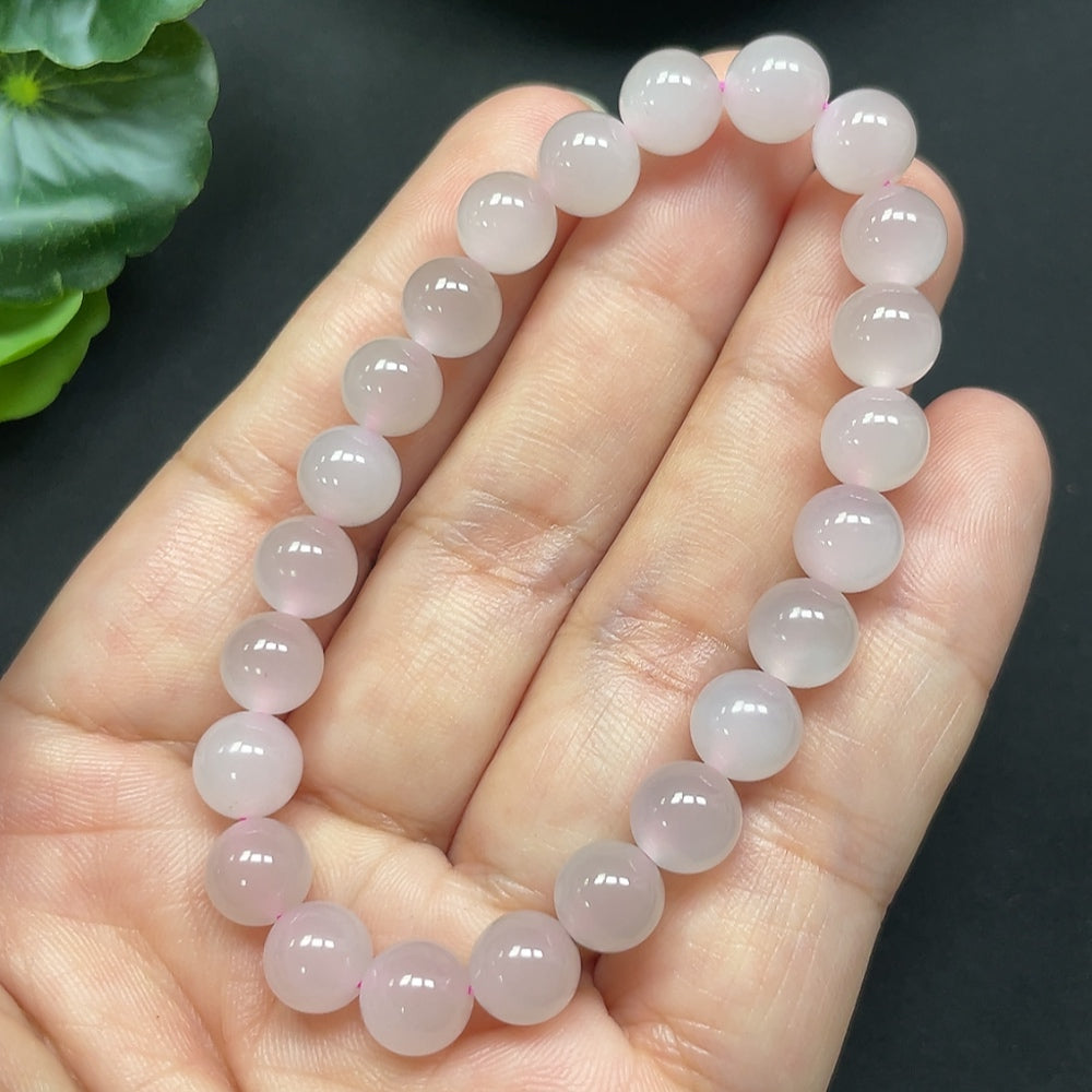 Hetian jade bracelet with 7.7mm beads, featuring smooth, polished green jade stones, crafted by HKHQ.