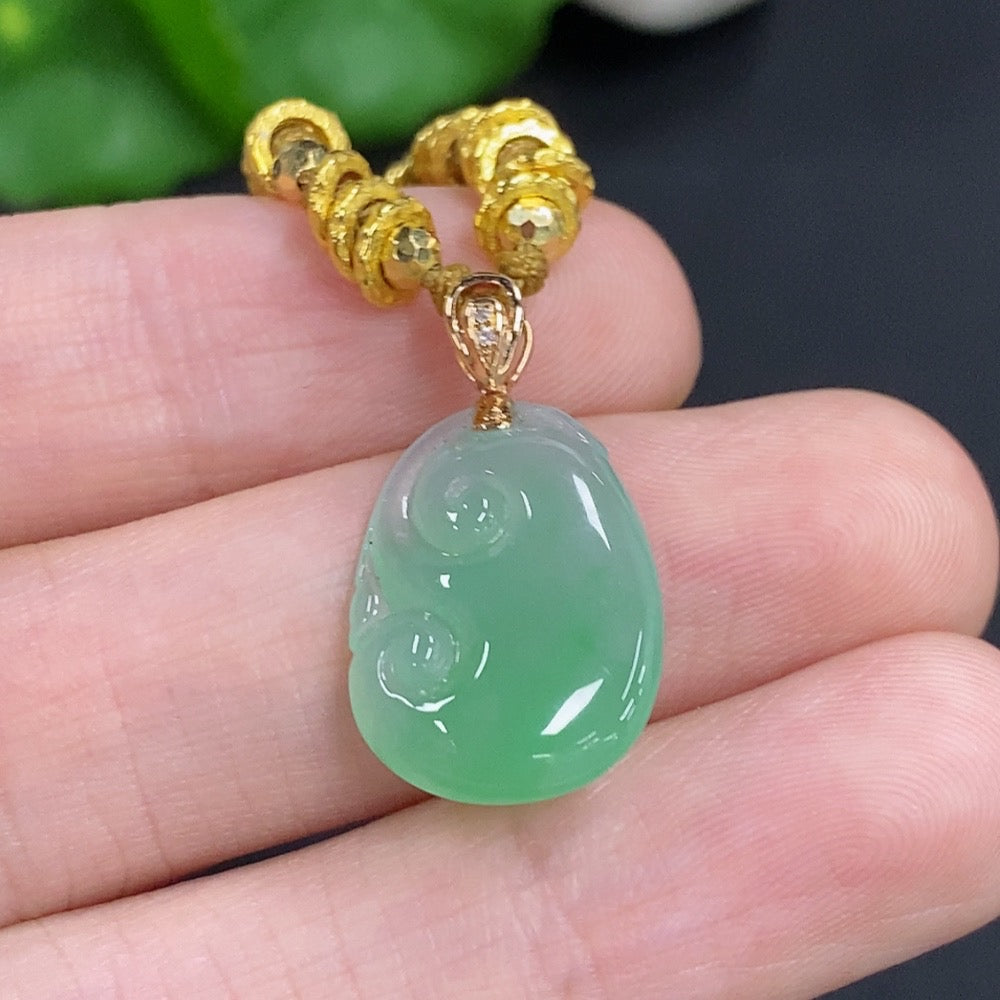 Jadeite Ruyi pendant with 18K gold accents and diamond details, featuring a cord, weighing approximately 4.78 grams.