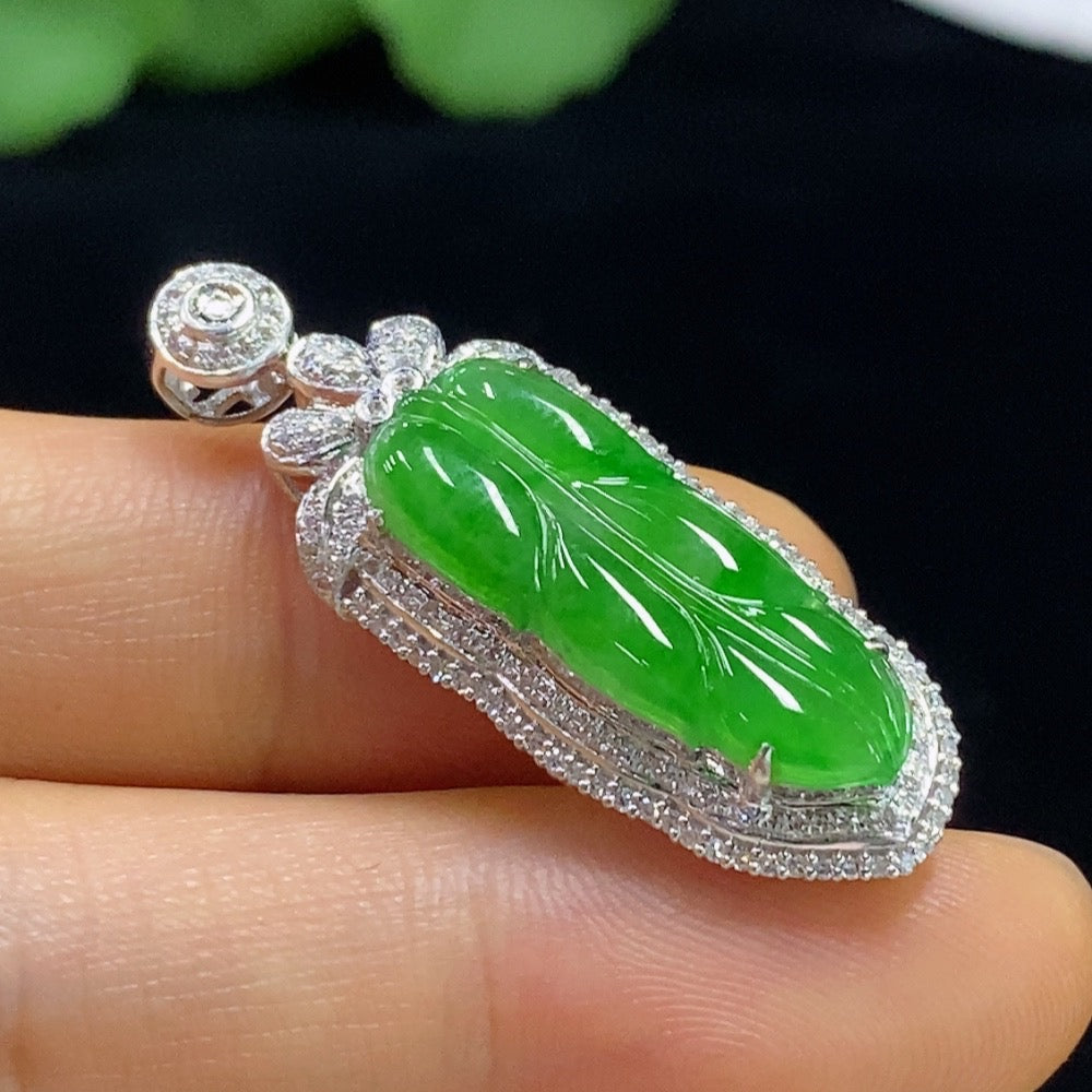 Jadeite leaf pendant with 18k gold and diamond accents, crafted by HUILIU HQ, showcasing intricate design and elegant craftsmanship.