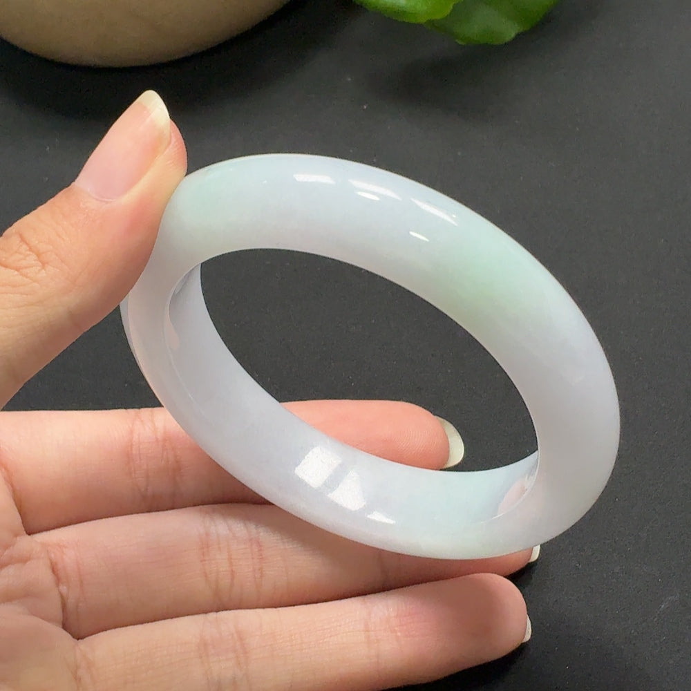 Jadeite round bracelet with size 54.3, approximately 68.93g, featuring smooth, polished jade stones on a HKHQ brand jewelry piece.