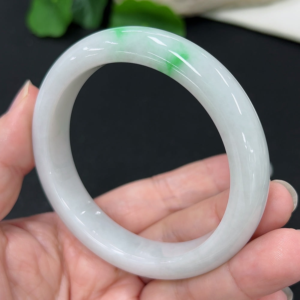 HKHQ jadeite round bangle, size 57.4mm, weighing 60.67g, showcasing smooth, polished jadeite bracelet with natural green hues.