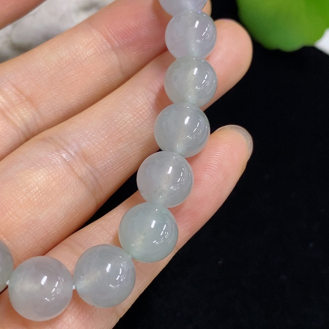 HKHQ jadeite bracelet weighing 28.68g, featuring smooth green jadeite stones, elegant and polished jewelry accessory.
