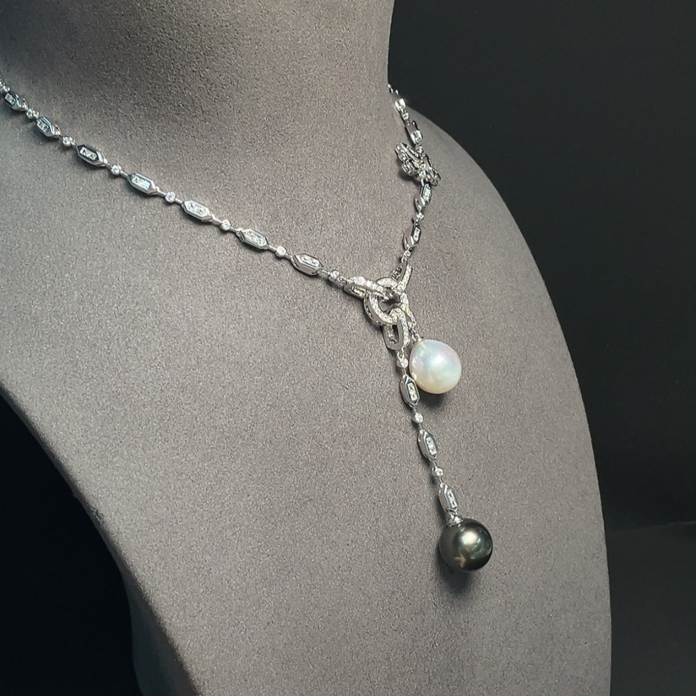 Seawater pearl necklace featuring black and white pearls, approximately 13.1mm and 12.3mm, from HKHQ.