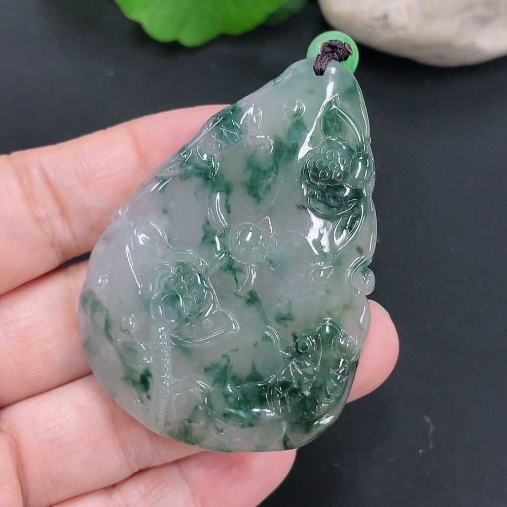 Huiliu Jadeite Auspicious Yearly Abundance Pendant featuring intricate carvings on smooth green jade.