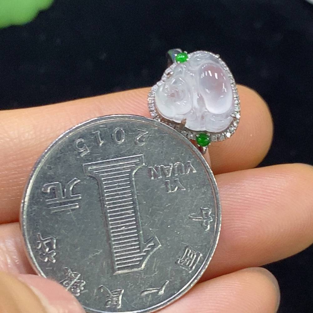 Huiliu jadeite ring set with diamond accents, showcasing a polished jadeite gemstone in a silver band, certified by Huiliu HQ.