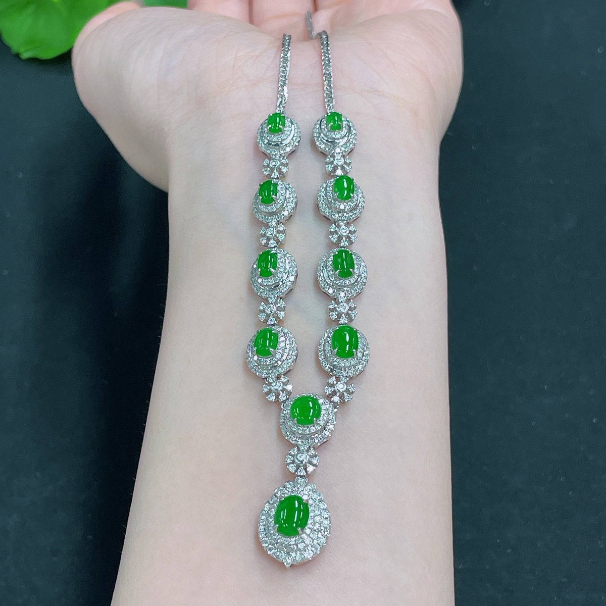 HUILIU HQ Jadeite necklace set with diamonds, featuring a polished jade pendant and matching earrings, elegant and luxurious.