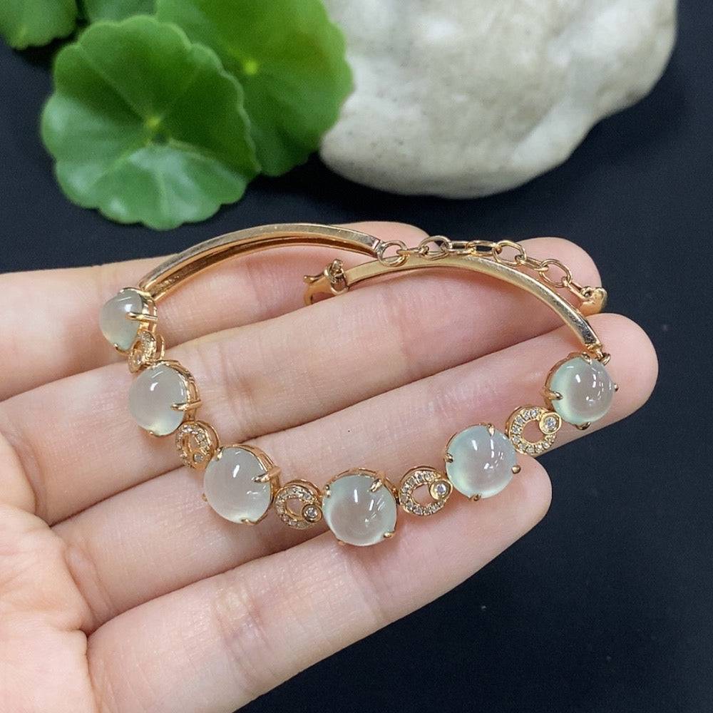 Huiliu jadeite cabochon bracelet with diamond accents, showcasing smooth green jade stones in a stylish jewelry set.