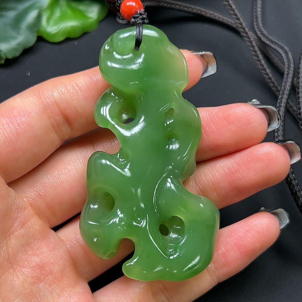 HKHQ Hetian Jade and coral stone pendant necklace with rope, approximately 48.17g, featuring a detailed jade and coral stone design.