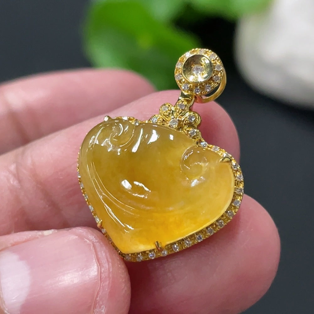 Jadeite Ruyi pendant with 18K gold and diamond accents, featuring intricate inlay and a polished jade surface.