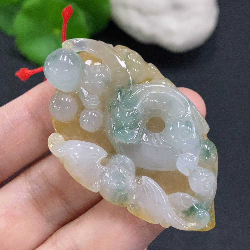 Jadeite pendant with cord, total weight approximately 25.2g (color origin undetermined)