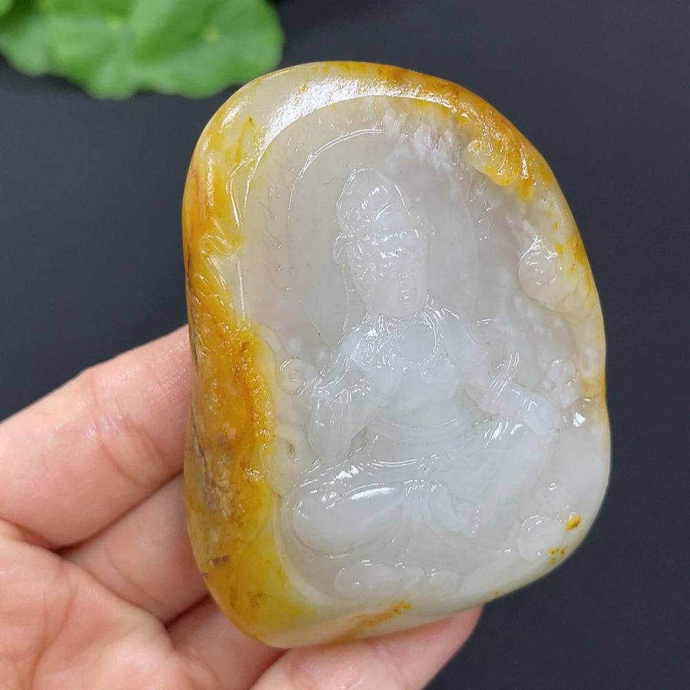 Huiliu HQ Hetian jade pendant featuring Guanyin figure with natural mineral variations and undetermined skin tone.