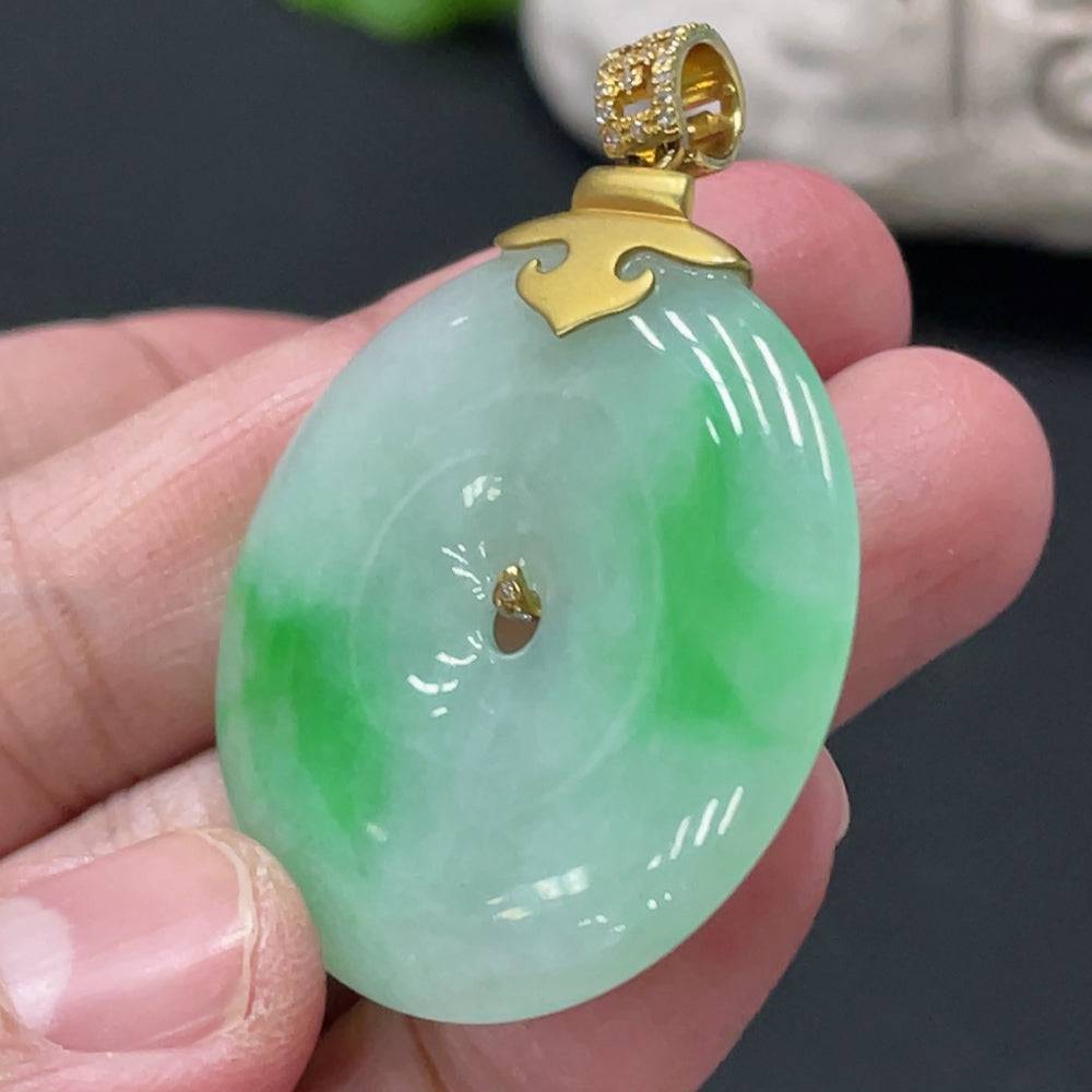 Jadeite Peace Knot pendant with diamond accents, 18K gold clasp, showcasing intricate jade craftsmanship and smooth polished finish.