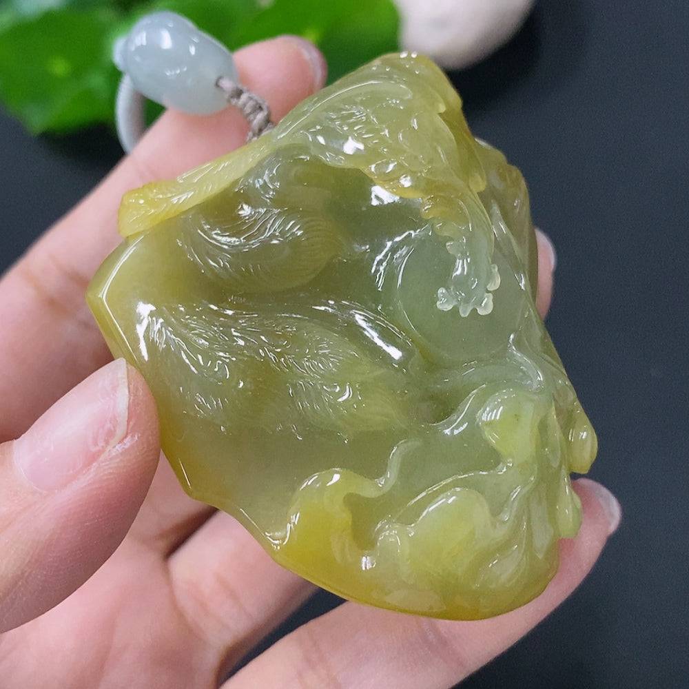 Jadeite pendant featuring a phoenix design by HUILIU HQ, weighing 81g with rope, in natural green jade color.