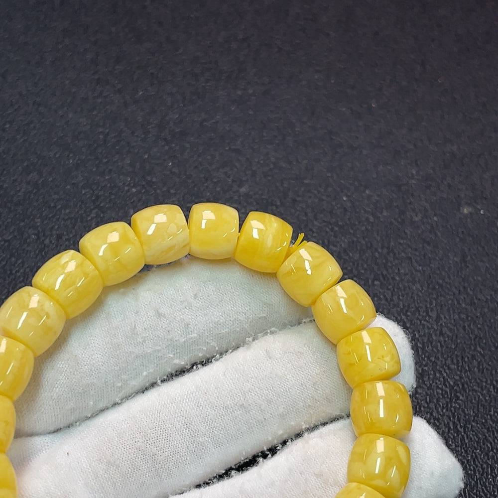 Amber beeswax bracelet by HUILIU HQ featuring natural amber beads, approx. 16.42g weight and 10.6mm size.