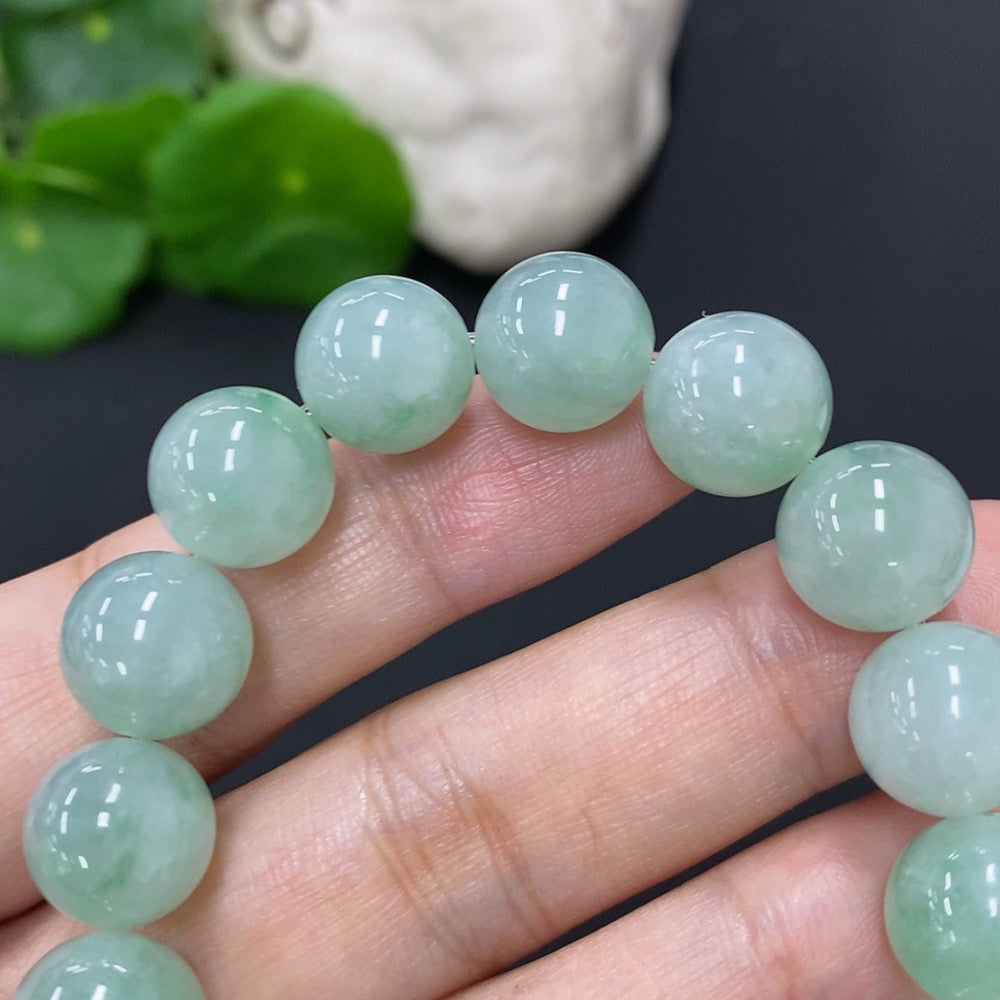 HKHQ jadeite bracelet with 11mm beads, total weight approximately 39.8g, showcasing smooth, polished jade jewelry.