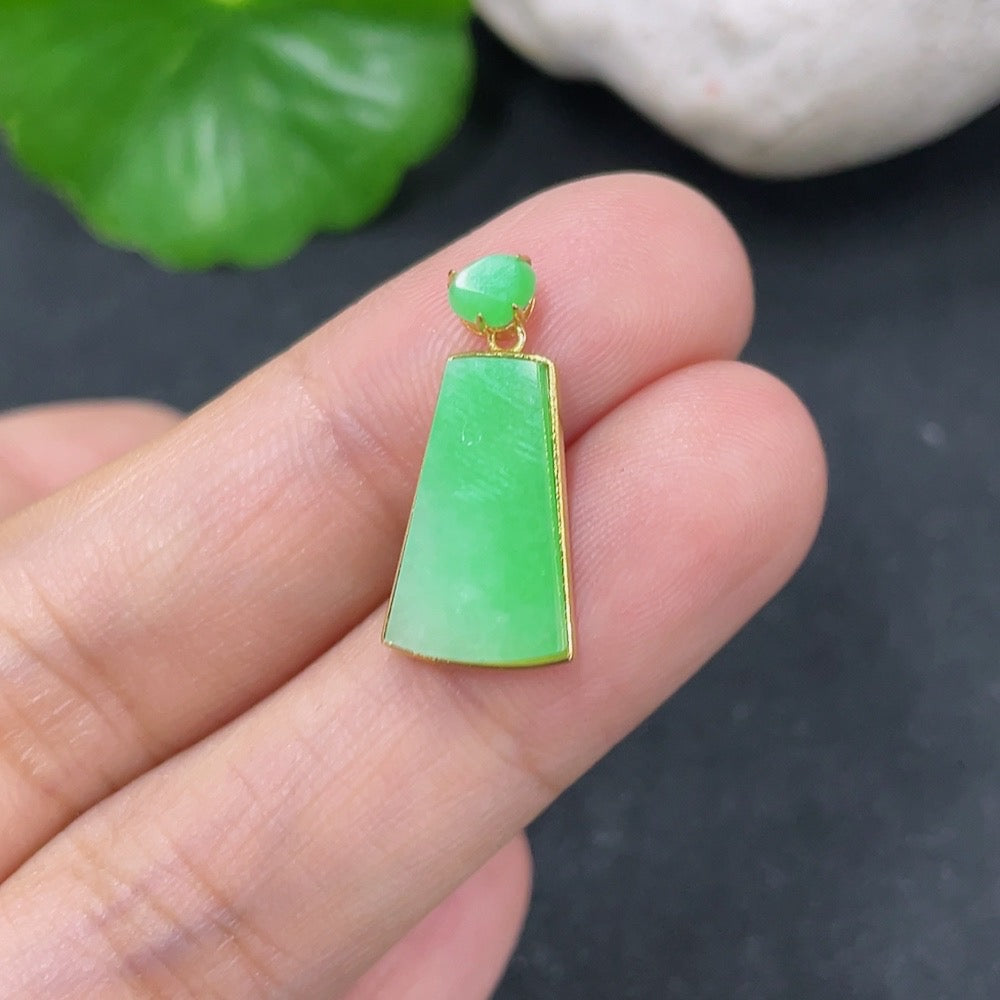 Jadeite plain pendant with 18k gold setting, weighing approximately 1.42g, featuring smooth, polished jade stone in an elegant design