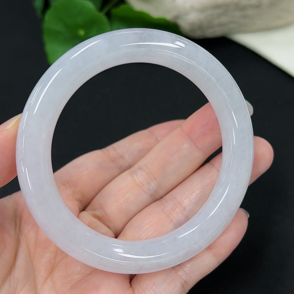 Jadeite round bangle in size 55, weighing approx. 53.33g, crafted by HKHQ, showcasing smooth green jade with a polished finish.
