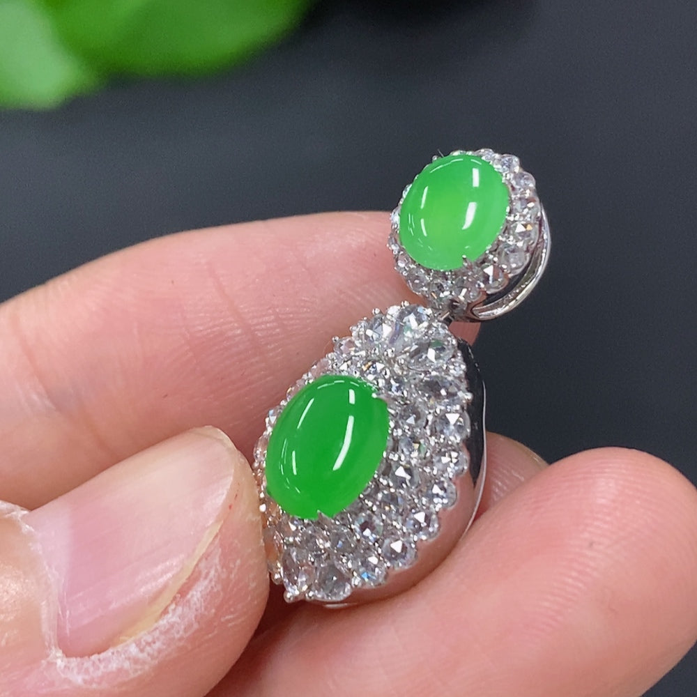 Jadeite cabochon pendant with diamond accents in 18K gold, weighing approximately 4.4g, featuring a polished green jade stone.