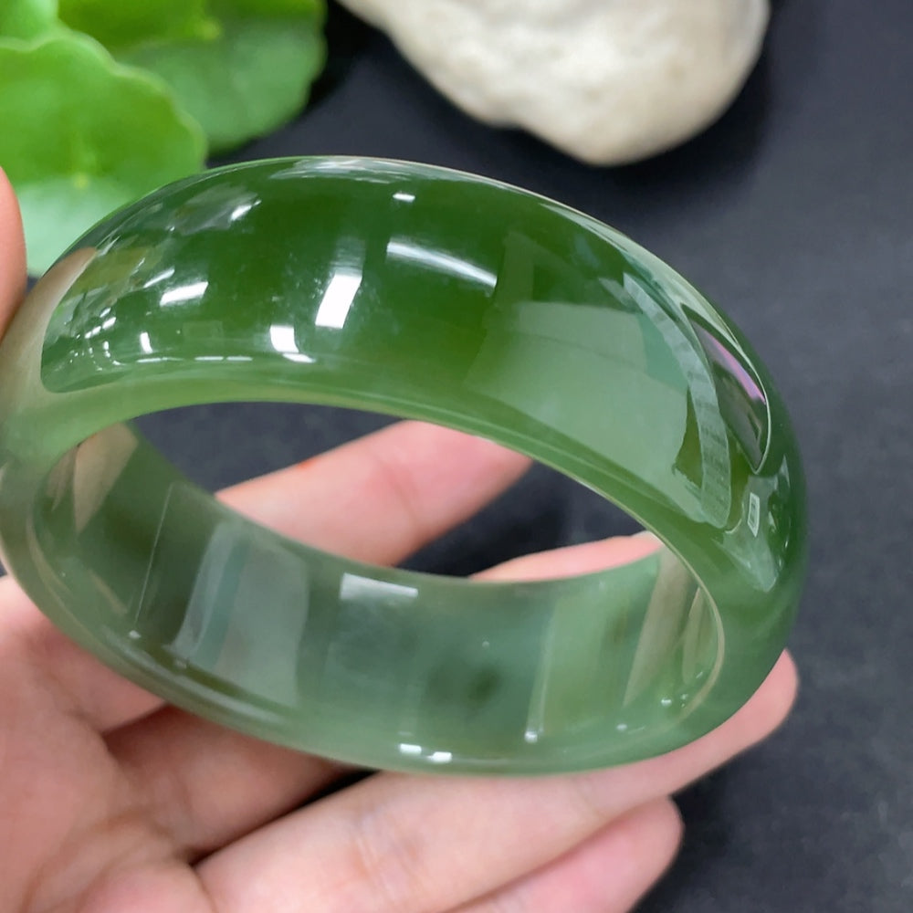 Green Hetian jade round bracelet by HKHQ, showing smooth, polished jade beads with a total weight of 96.6g and size 58.9.