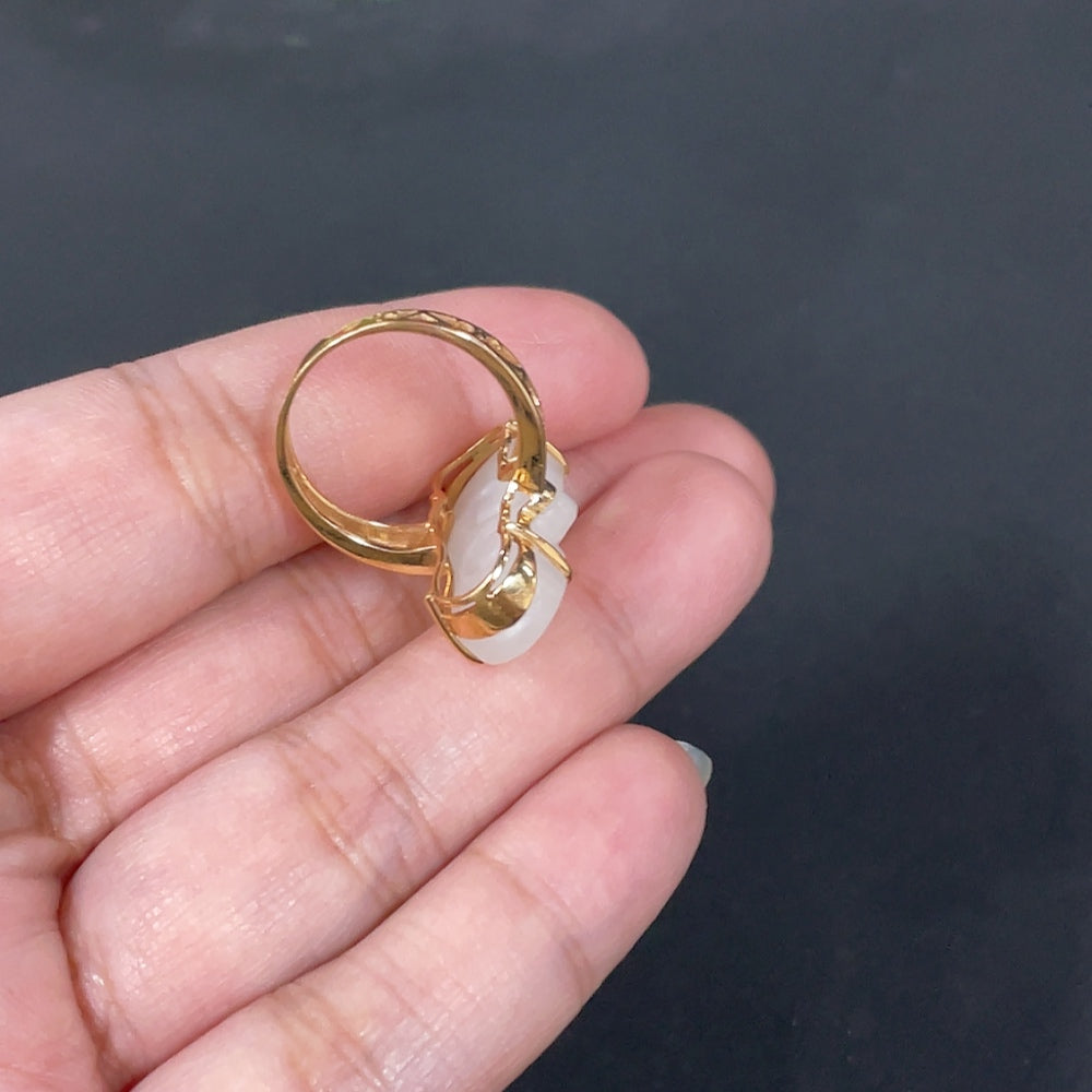 Huiliu Hetian Jade Inlaid Ruyi Ring featuring intricate jade carvings and silver inlay, showcasing traditional craftsmanship.