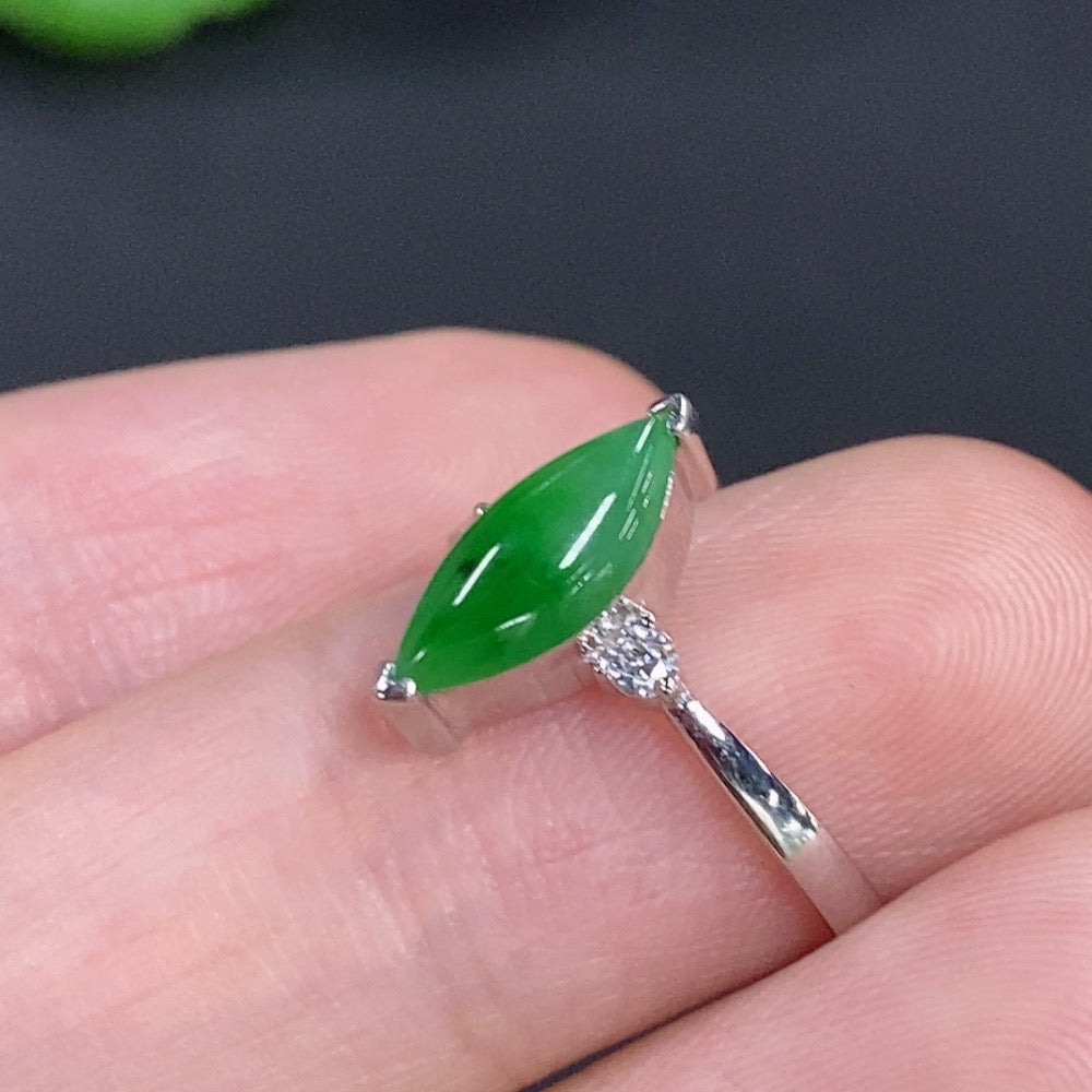 Jadeite freeform ring in 18K gold with diamond accents, showcasing a smooth, organic design and sparkling gemstone details.