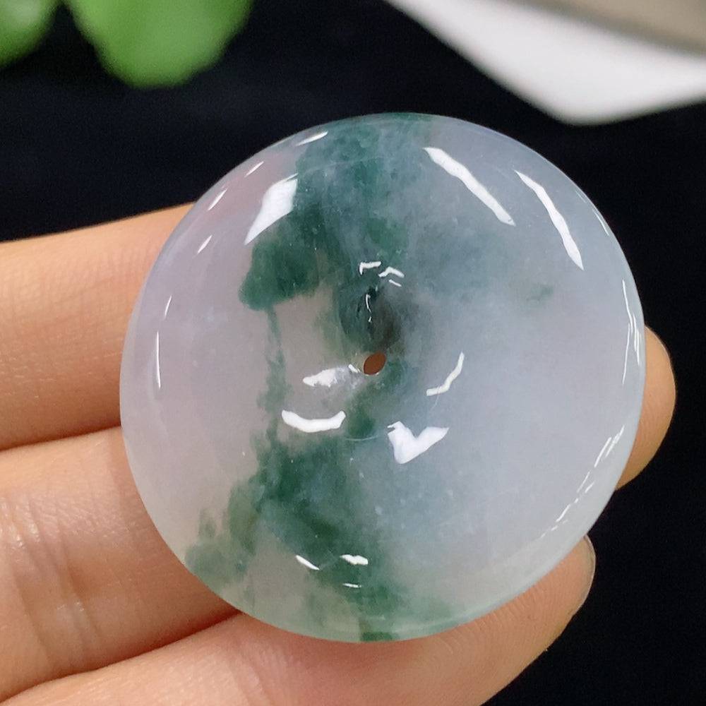 Huiliu Jadeite Peace Knot pendant featuring a polished green jade knot design on a cord, crafted by HUILIU HQ.