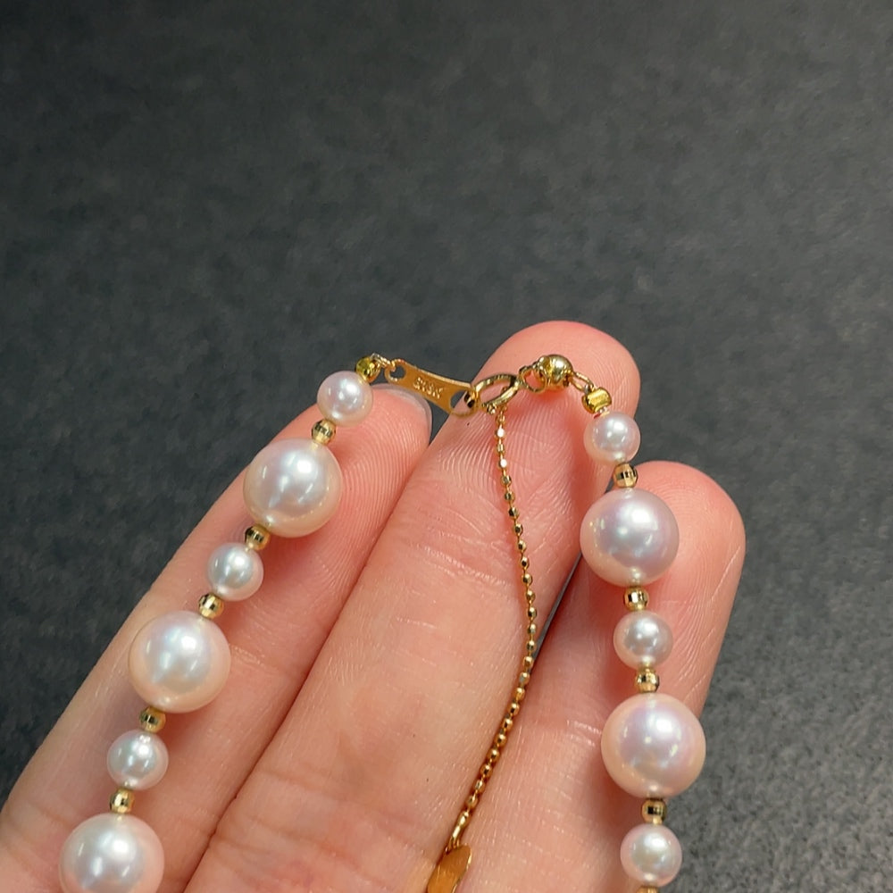 Seawater pearl bracelet by HUILIU HQ with red non-gold chain, 18k gold clasp, 4.3-7.2mm pearls, total weight 7.24g.